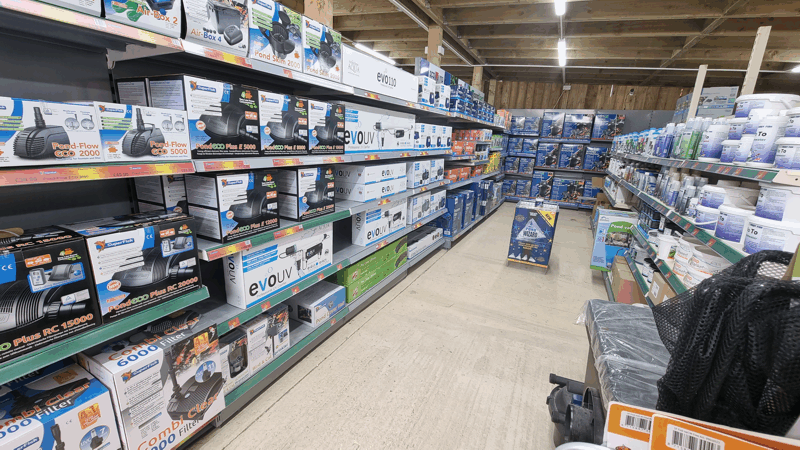 A Picture Of a different aisle in Fathoms Aquatics' Pond Goods section
